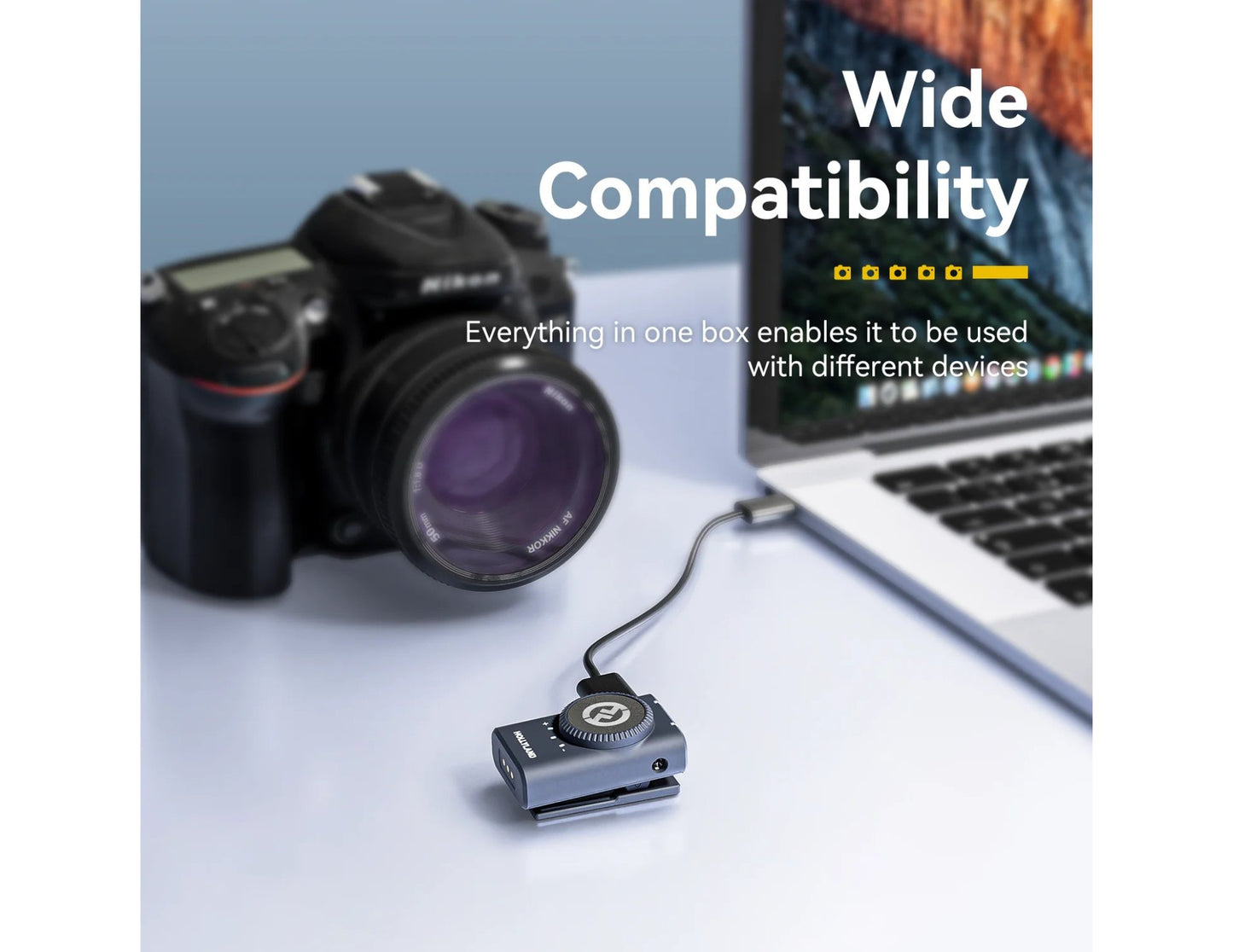 Camera, USB adapter, and laptop on a light surface with text about wide compatibility.