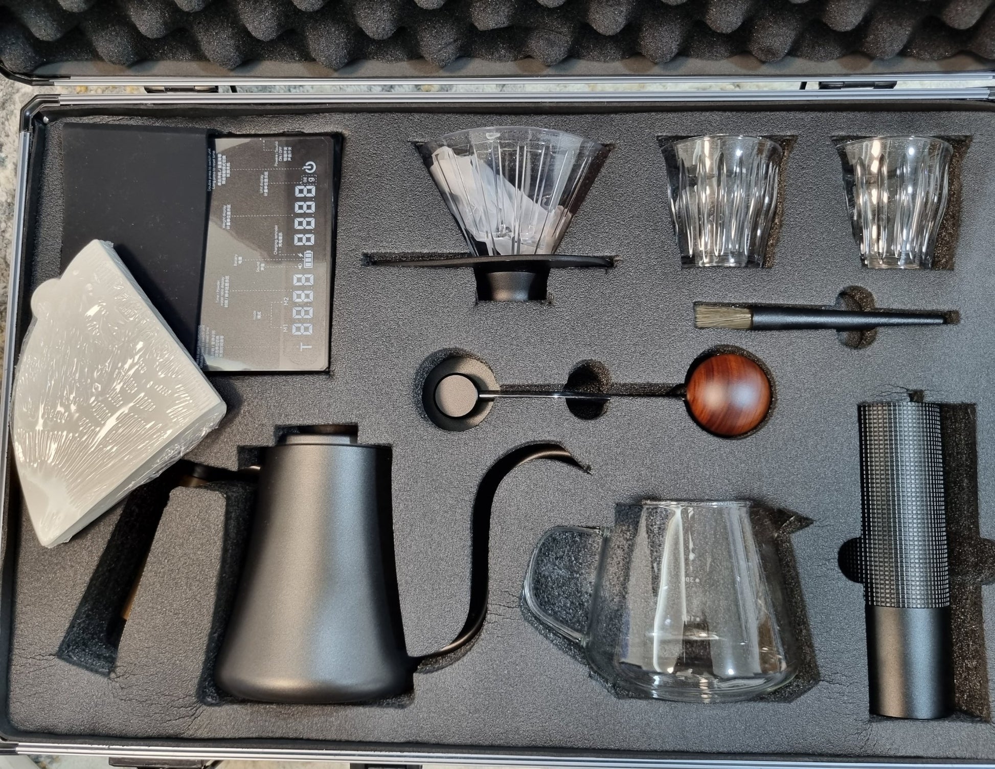 Coffee-making equipment set in a foam-lined case