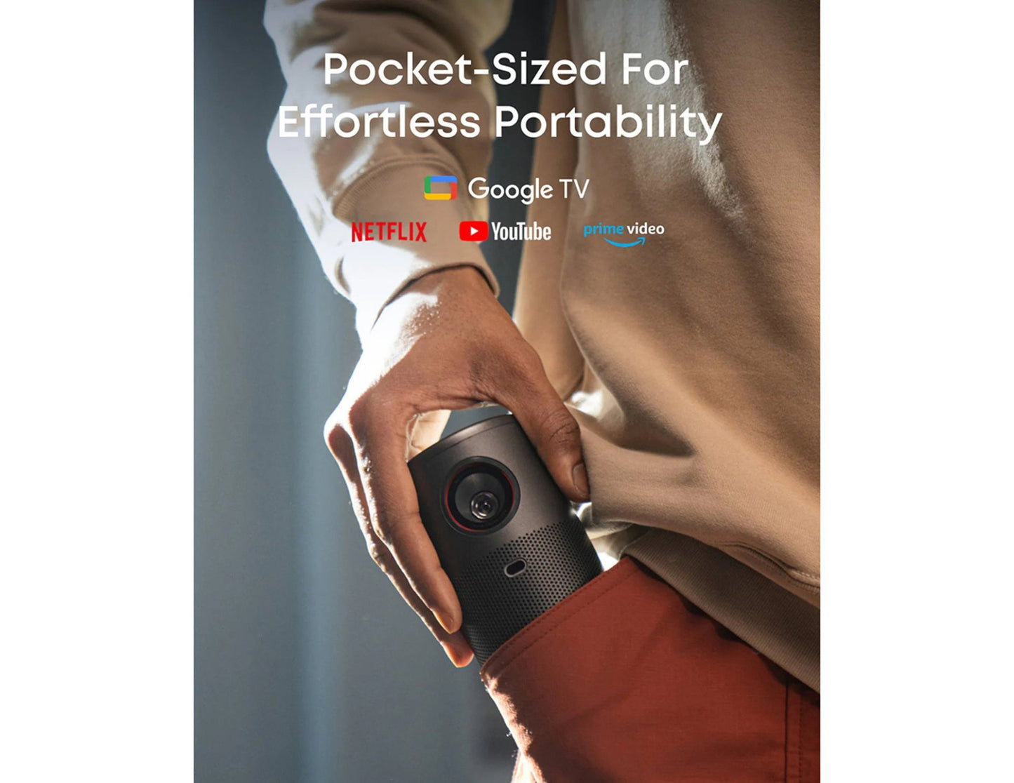 Hand holding a pocket-sized device with streaming app logos on a blurred background