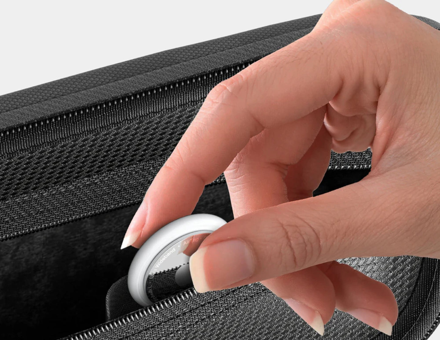 Hand zipping a black AmazingThing PlayShield EDC Carrying Case for Nintendo Switch 2 with a close-up of the zipper mechanism.