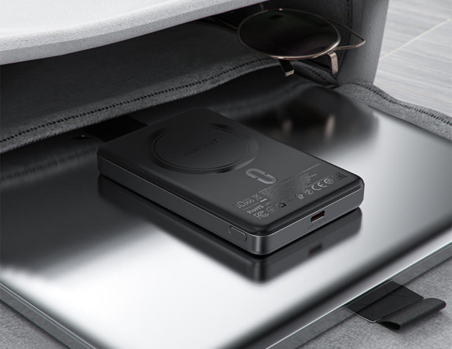 Acefast M12 10000mAh Power Bank on a metallic surface