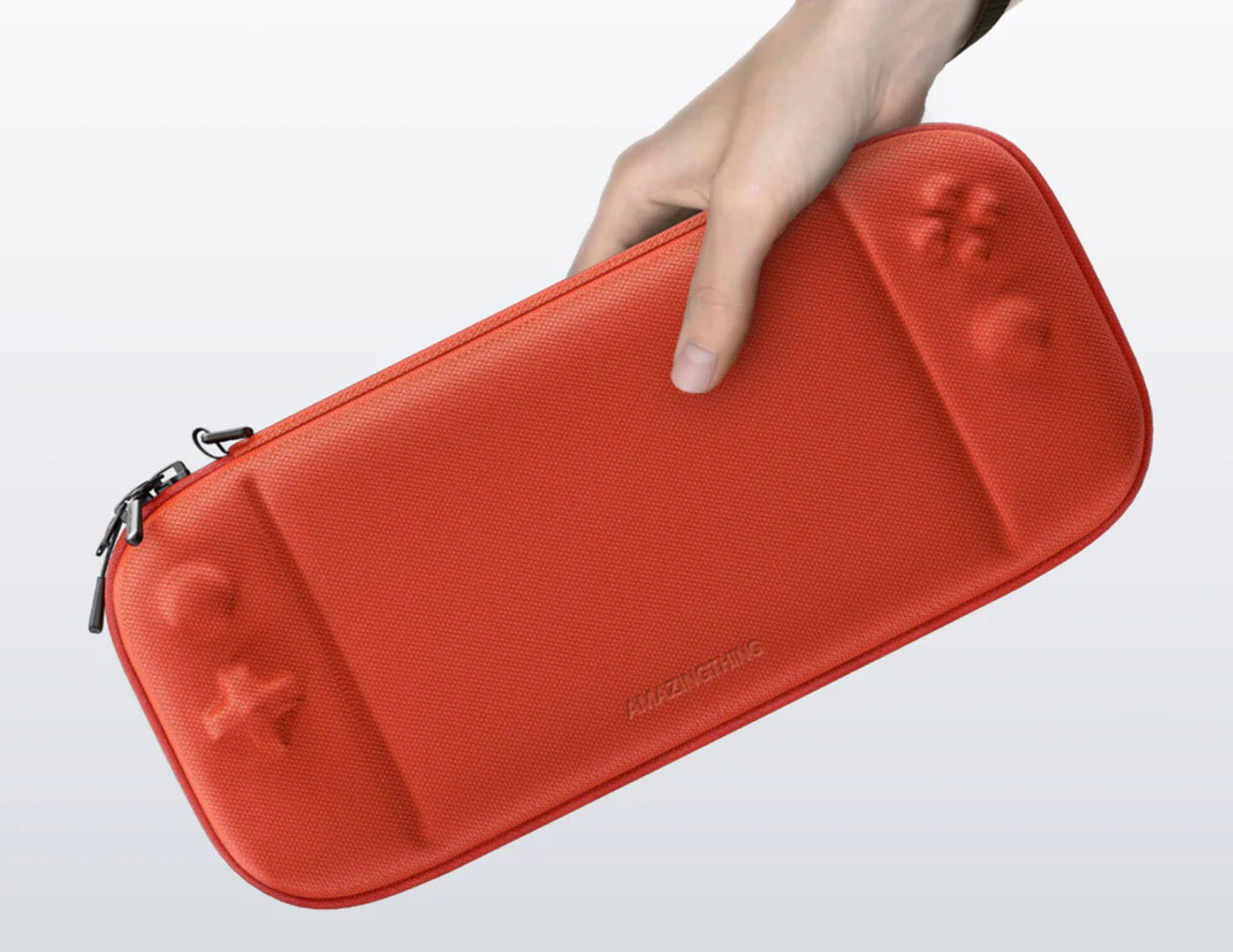 Red AmazingThing PlayShield EDC Carrying Case for Nintendo Switch 2 held by a hand on a light gray background