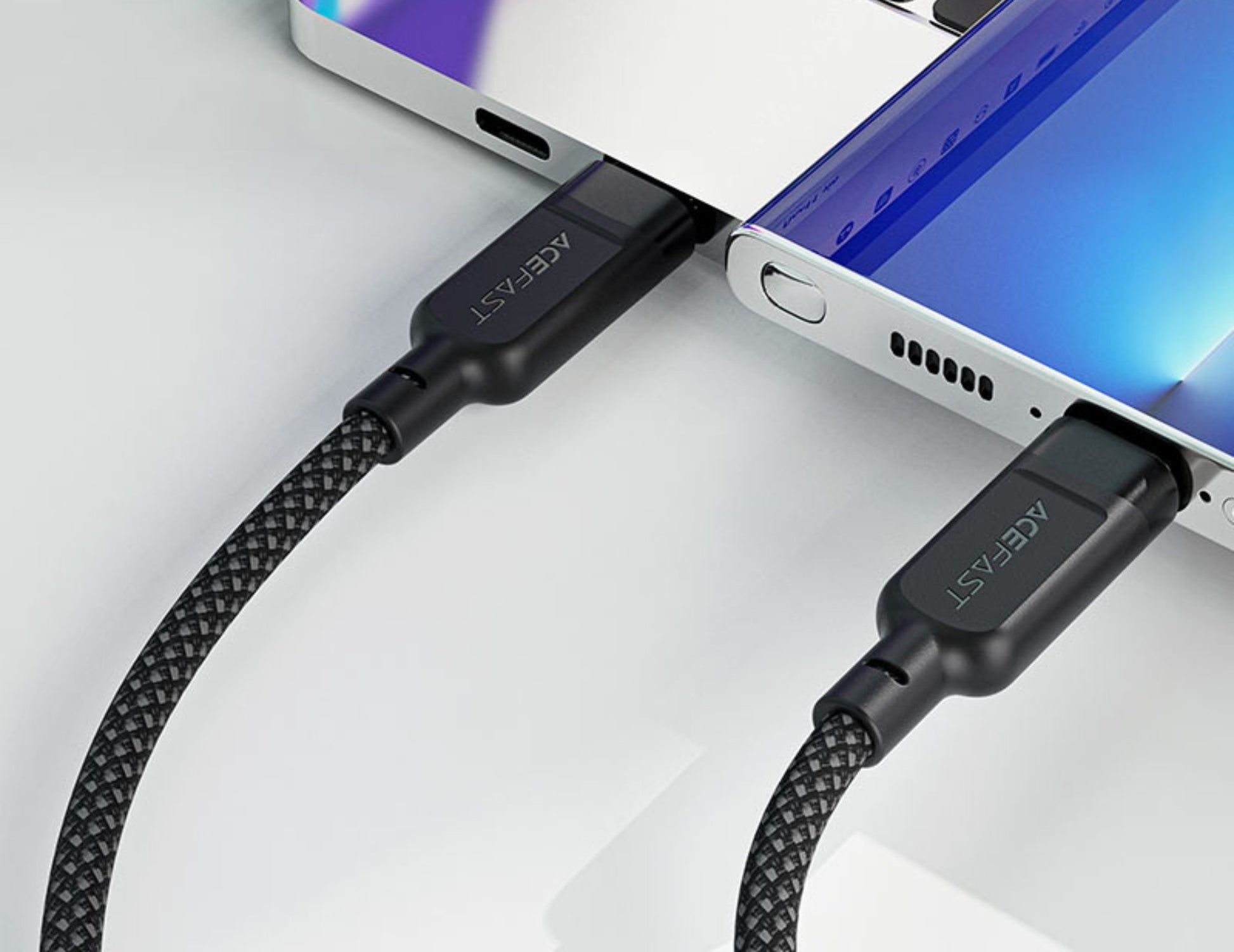 Black braided cable connected to a smartphone on a white background