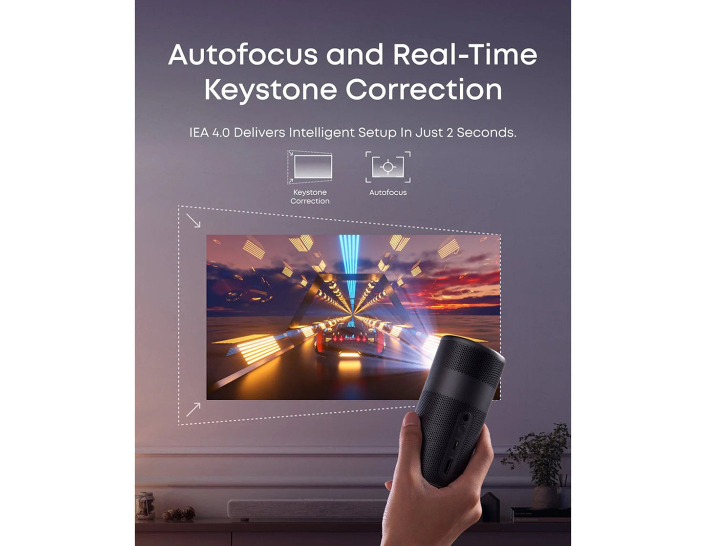 Hand holding a Anker Nebula Capsule Air (D4112211) HD Portable Projector with a screen displaying a projection of a scenic view, emphasizing autofocus and real-time keystone correction features.