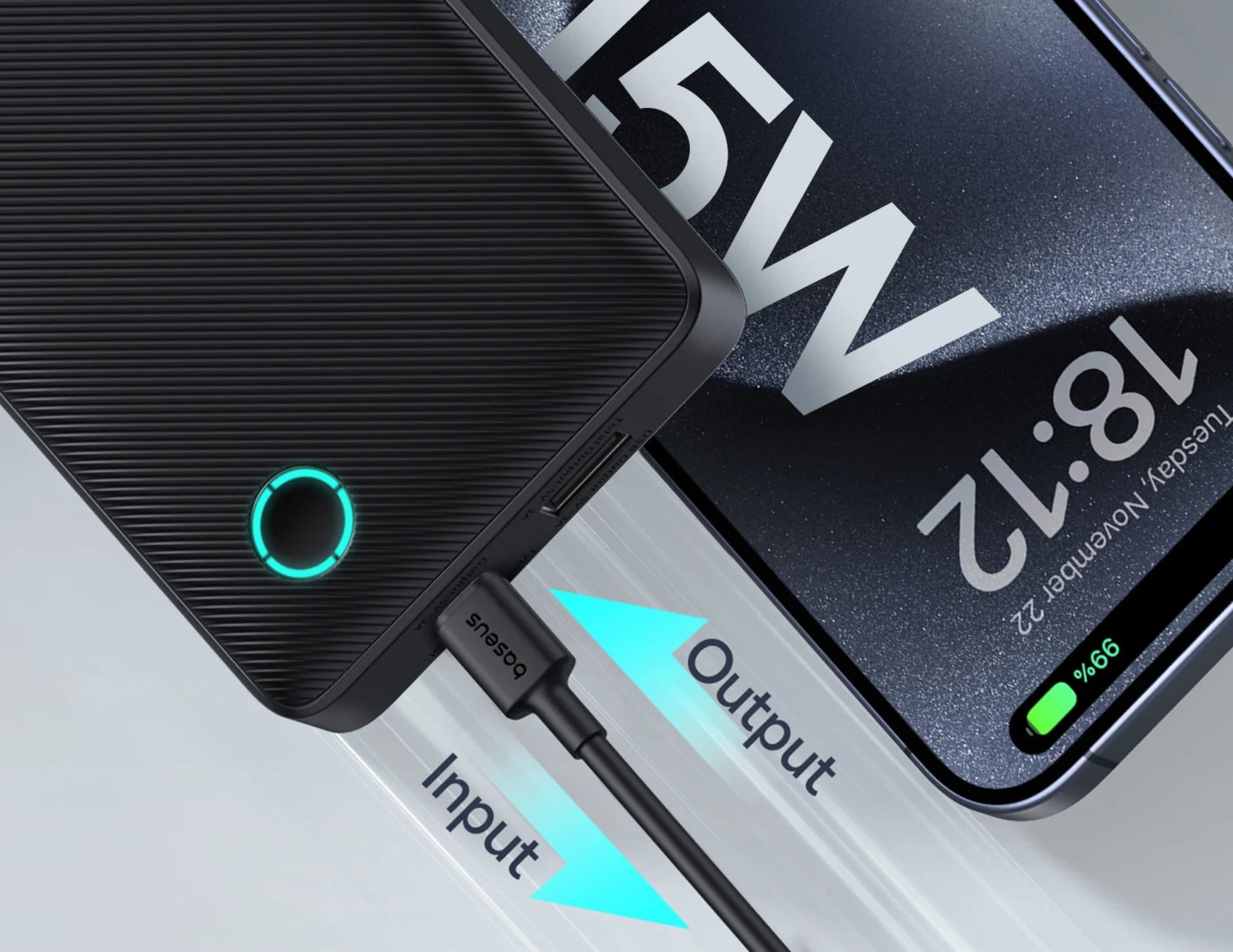 Black power bank with charging cable connected to a smartphone displaying battery information.