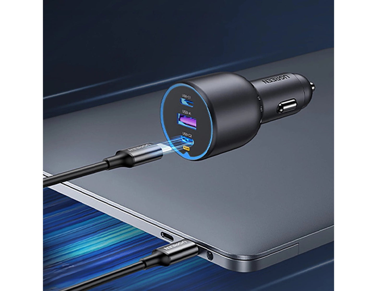 Car charger with multiple USB ports connected to a laptop on a dark background
