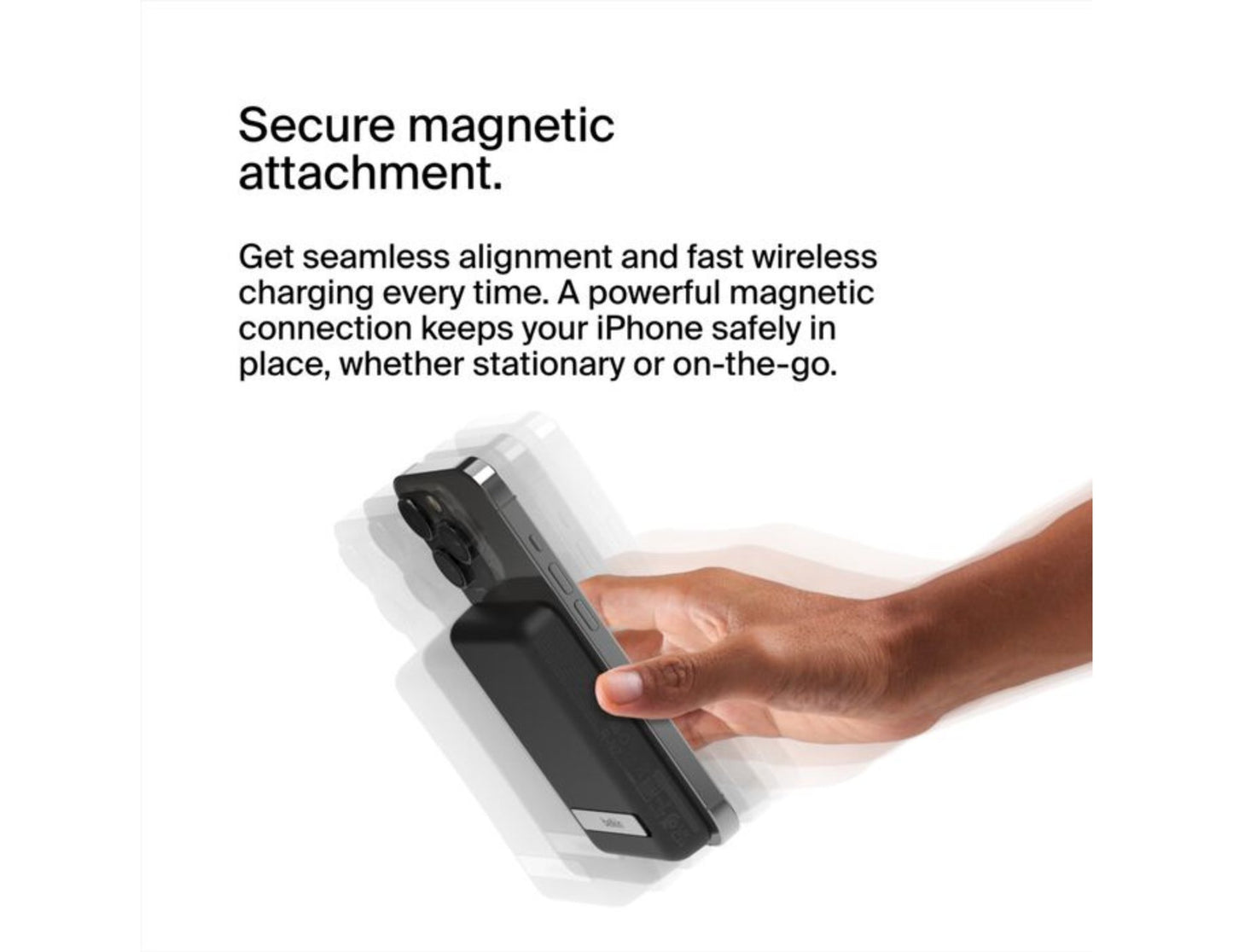 Hand holding a Belkin BoostCharge Magnetic Wireless Power Bank 5000mAh with Fold-out Stand – BPD004btBK – Black with text about secure magnetic attachment on a white background