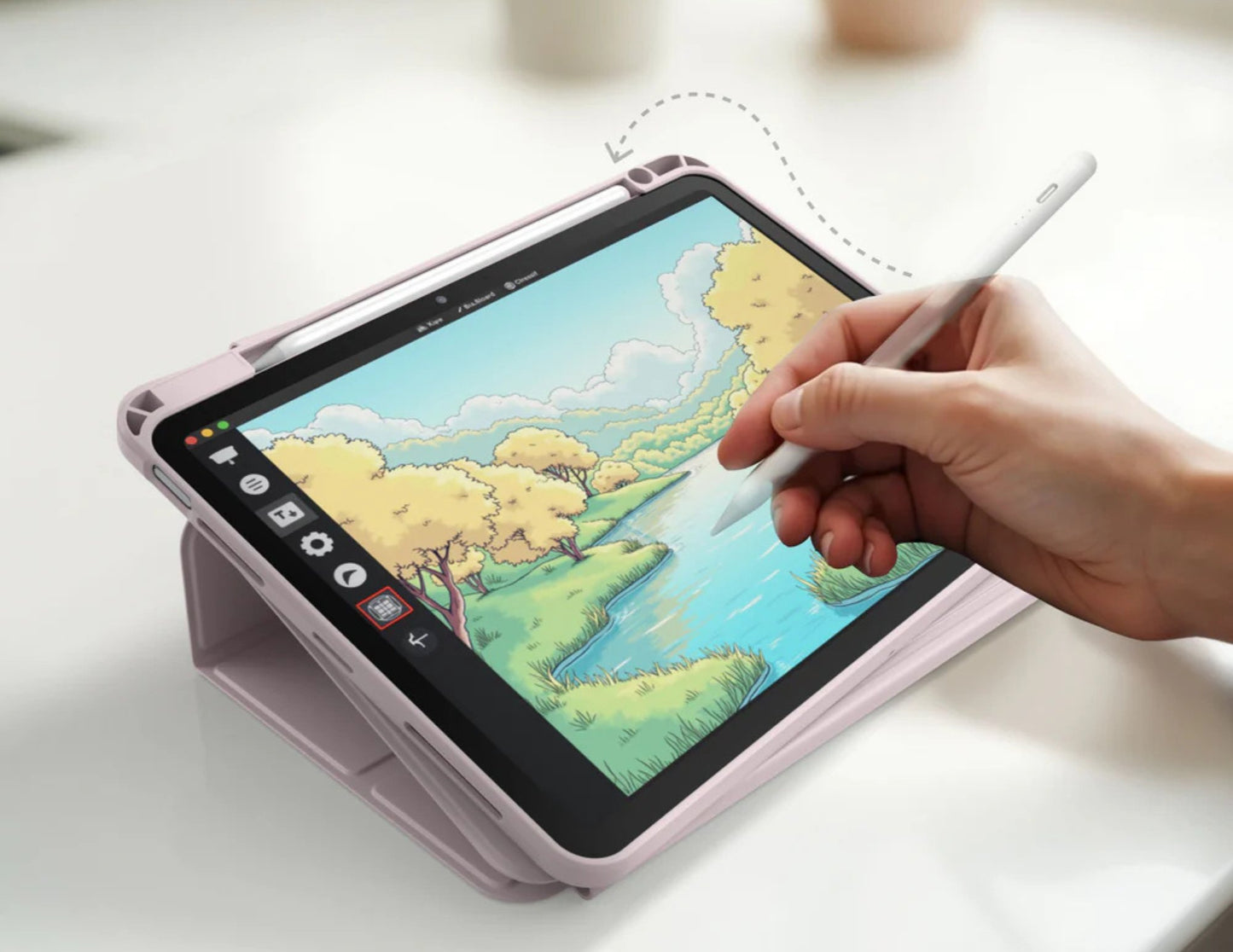 Person drawing on a tablet with a stylus on a light surface