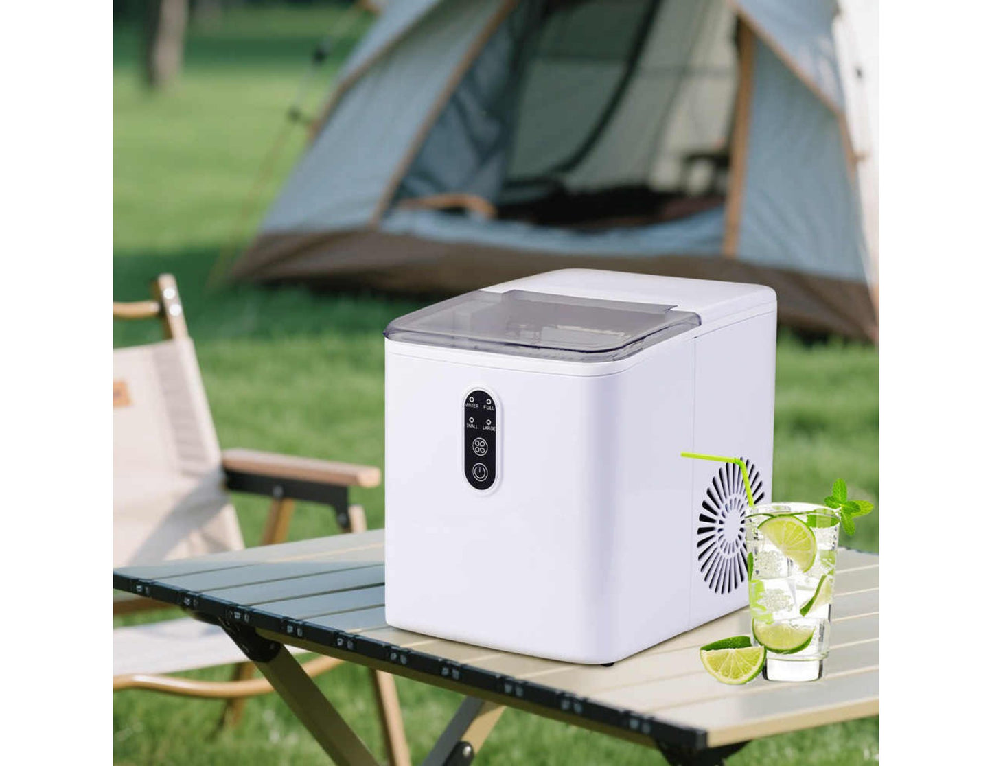 Winning Star Portable Ice Maker ST-9501 on a camping table with a drink and lime garnish, tent in the background