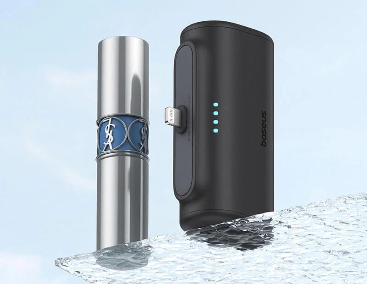 Two electronic devices, one silver and cylindrical, the other black and rectangular with a brand logo, on a light blue background.
