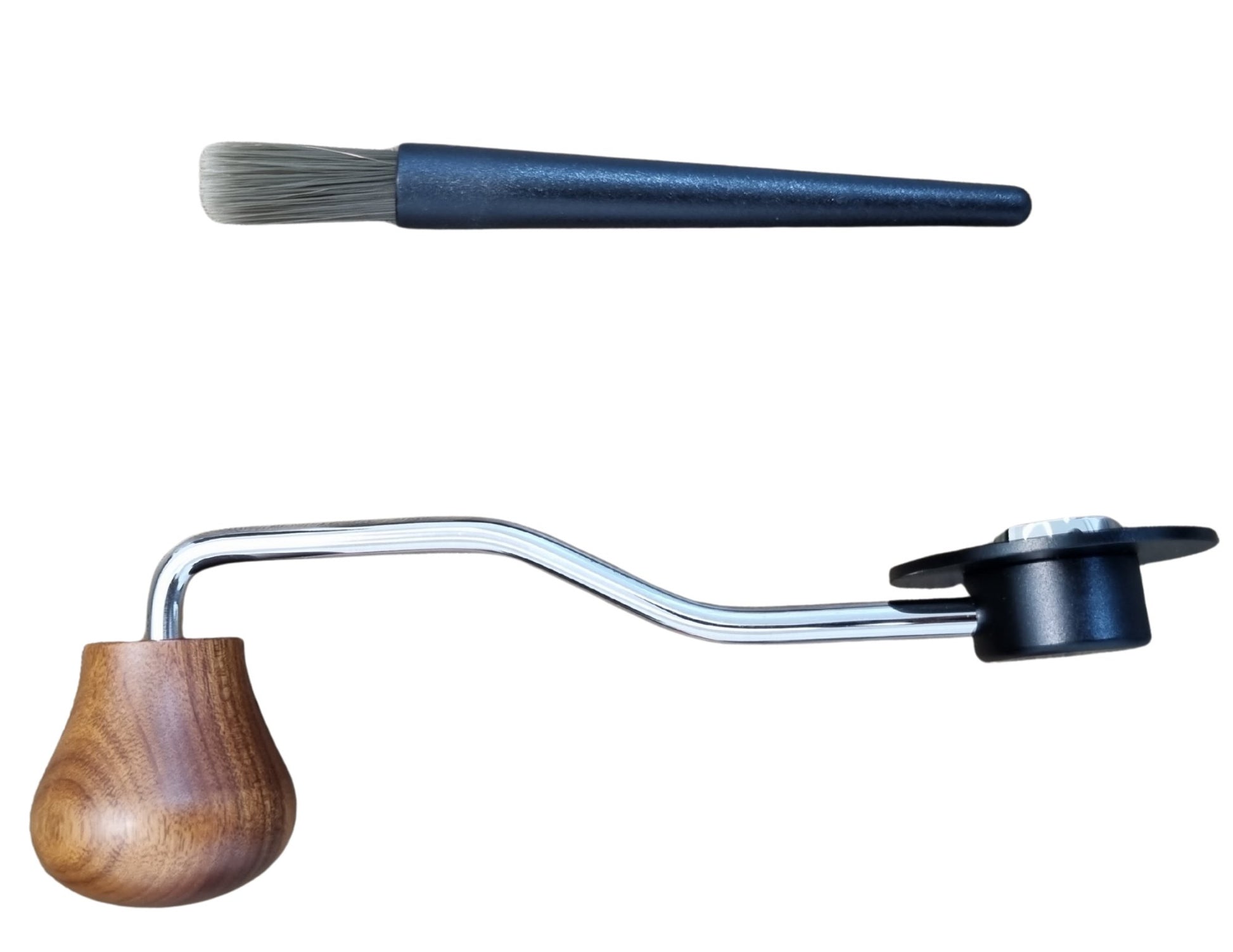 Coffee brewing device with wooden handle and metal spout on a white background