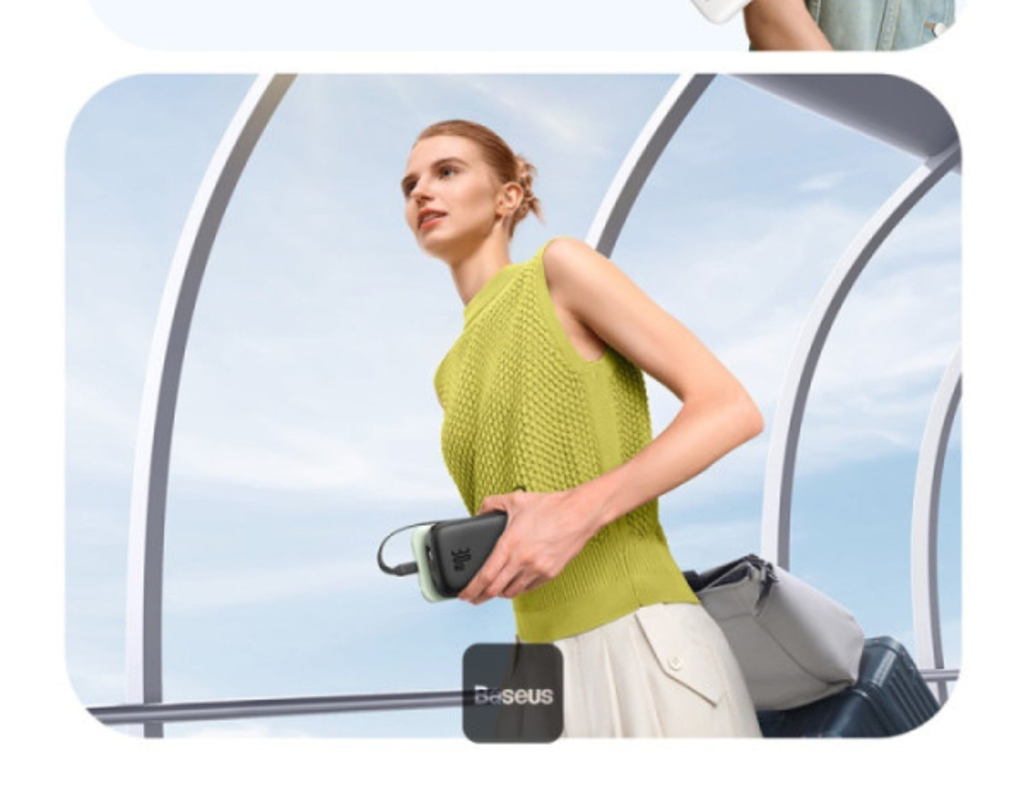 Woman holding a suitcase with a clear sky background