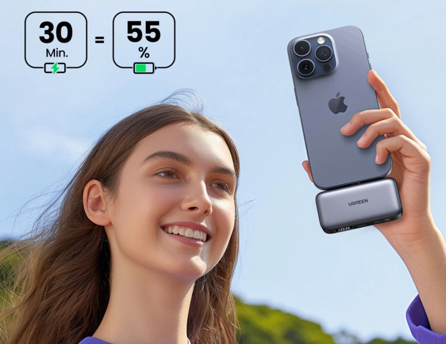 Person holding a smartphone with UGREEN Nexode 5000mAh 20W Power Bank with Built-in USB-C Connector – PB503, outdoors