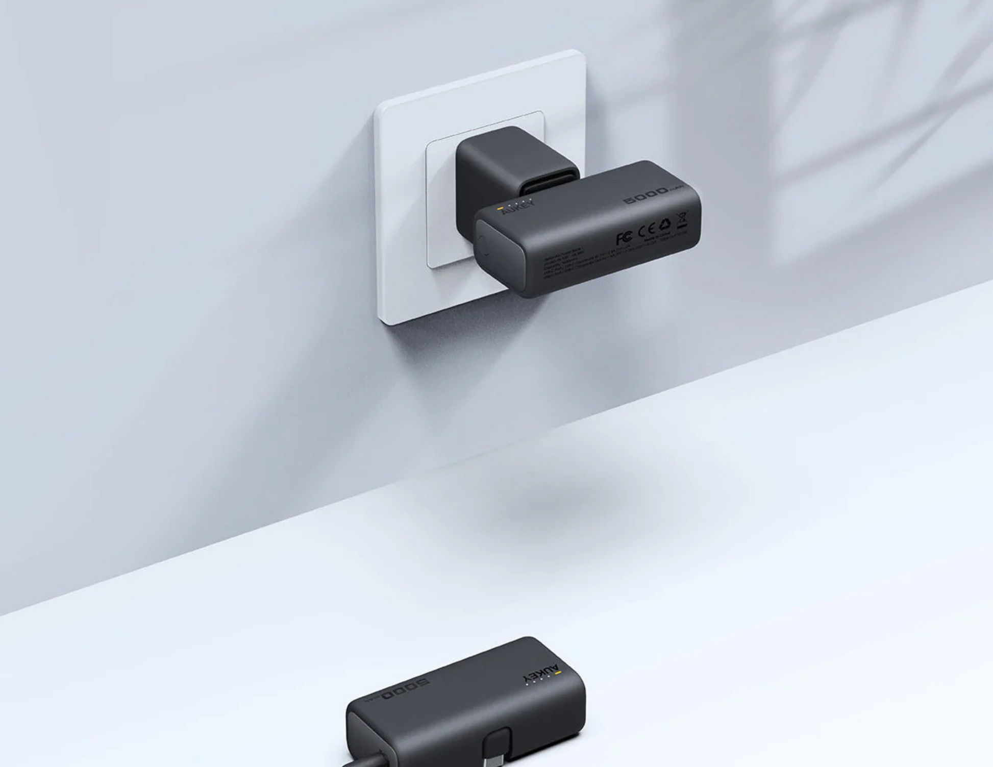 Side view of Aukey Spark Mini PB-Y59-GY highlighting its sleek and portable build.