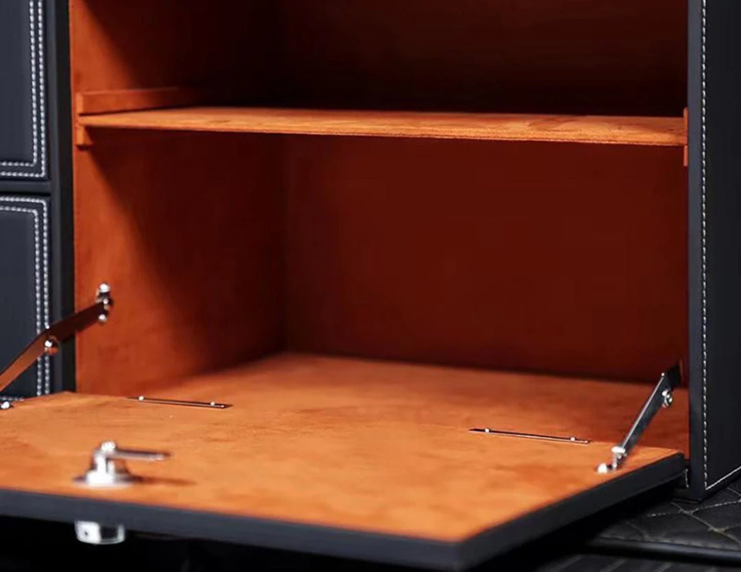 Spacious interior of the car trunk storage box with adjustable compartments and drawers.