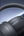 Gray headphones with baseus logo on a dark blue gradient background