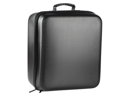 Black carbon fiber-patterned hard-shell suitcase on a white background