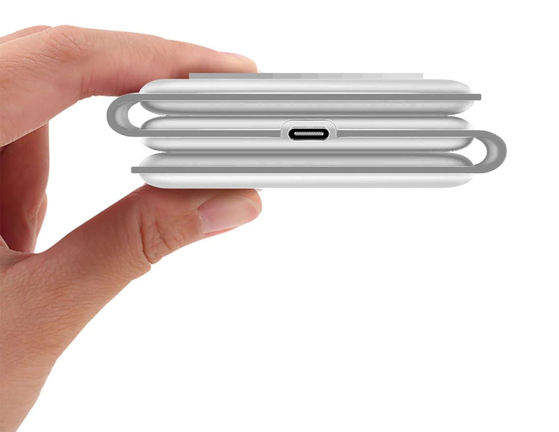 Hand holding a Black Gripp 3-in-1 Foldable MagSafe Magnetic Wireless Charger – GR-WLC3M on a white background