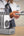 Person using a wireless charging device with WST 6-IN-1 10000mAh Power Bank Docking Station – PB932W6M
