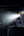 Phone with flashlight app illuminating car engine