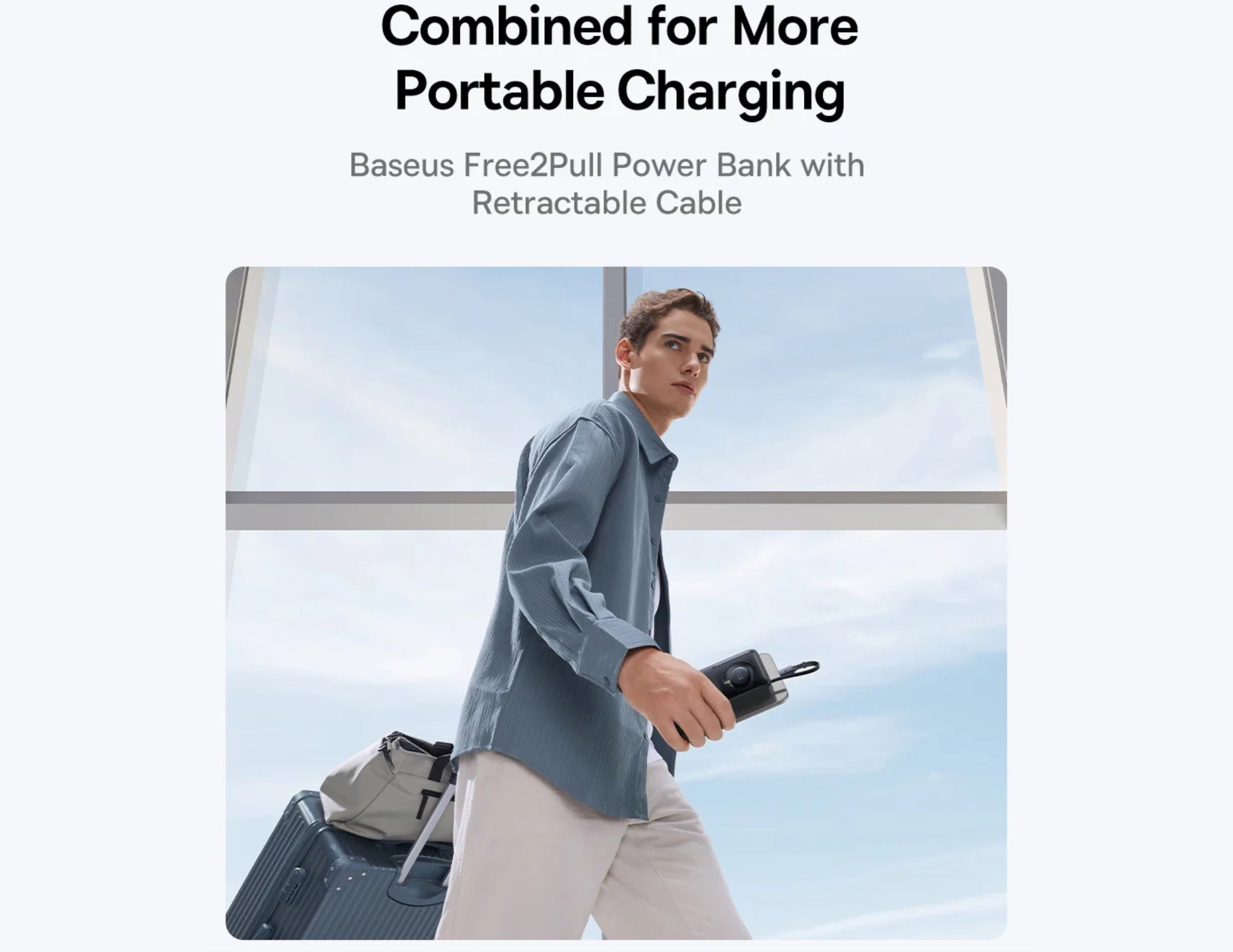 Person holding a power bank with retractable cable against a window background