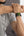 Person wearing a smartwatch on their wrist with a blurred background