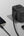 Black Momax 1‑World+ 70W GaN 3‑Port Travel Adapter with Retractable USB‑C Cable – UA18 connected to a smartphone and tablet on a light gray background.