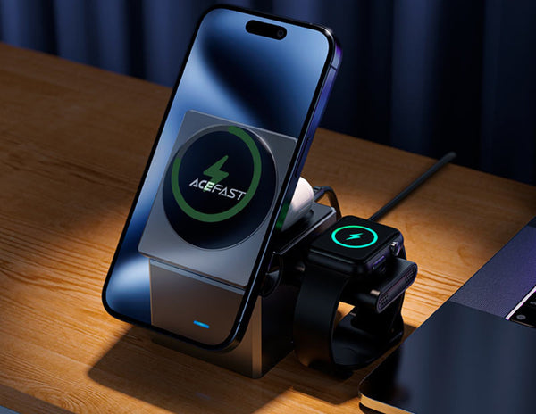 Smartphone with a charging stand displaying 'ACEFAST' on a wooden surface.