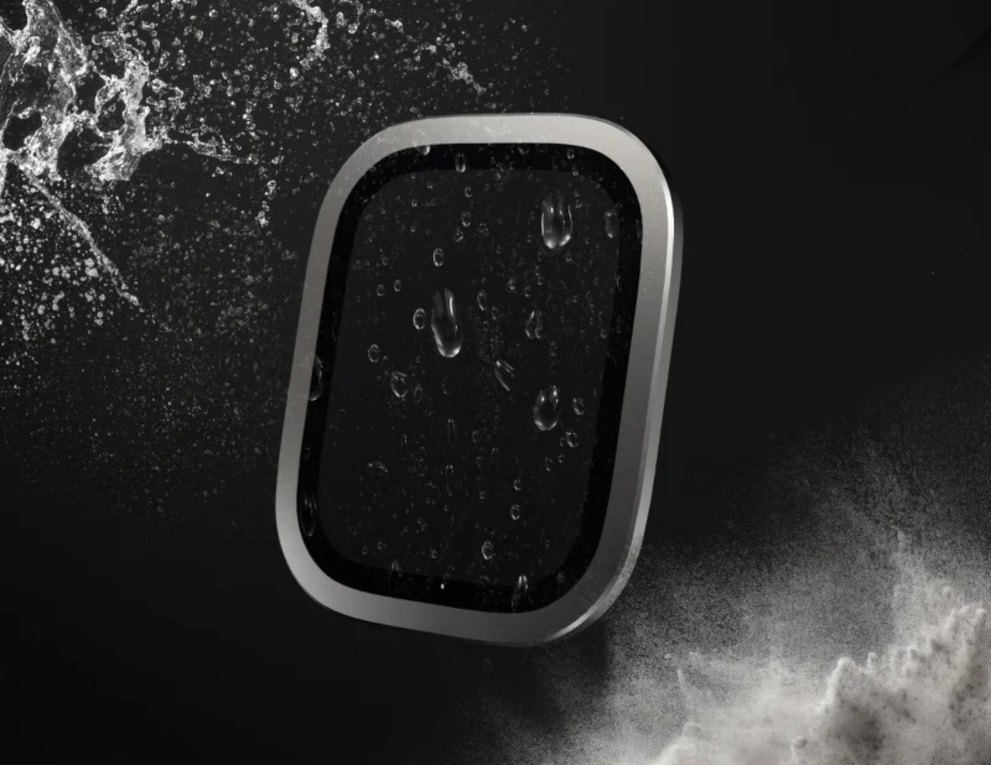 Black rectangular object with water droplets on a dark background