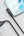 Phone and laptop connected by a cable on a light gray background