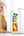 PAWA Mini Refrigerator 10L PW10LMR-WH with drinks on a table, woman in background
