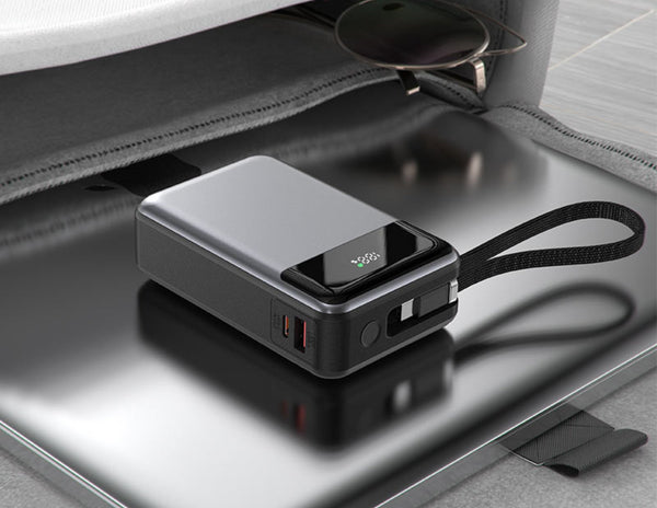 Acefast M21 20000mAh PD65W Power Bank with a strap on a metallic surface