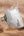 Lexar Professional USB drive being submerged in water on a sandy background