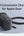 Black charging adapter with USB cable on a light gray background
