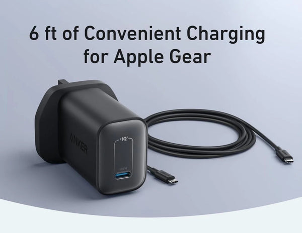 Black charging adapter with USB cable on a light gray background