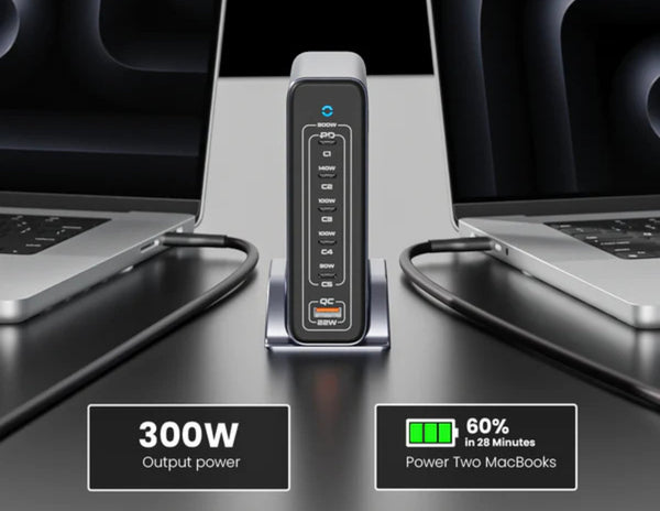 Power adapter with laptop on a desk, displaying power output and battery status.