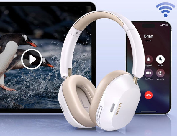 Beige headphones with a tablet and smartphone on a light blue background