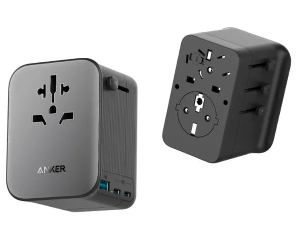 Two travel adapters, one gray and one black, with Anker branding on a white background.