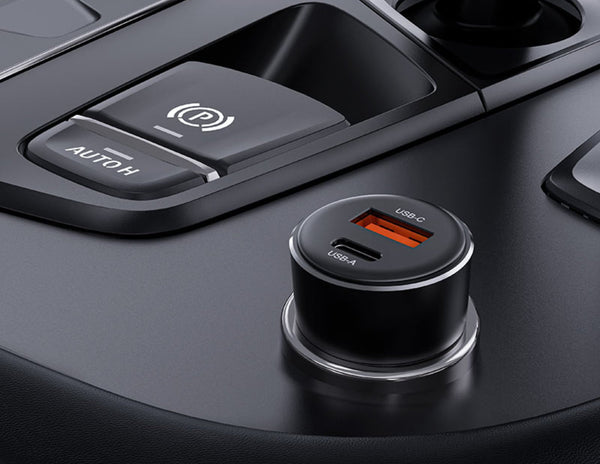 Car dashboard with a dual USB car charger and power window control.