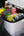 Portable cooler with drinks and snacks in a car trunk