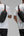 Person wearing a Tomtoc GameOn-G49 Nintendo Switch 2 Sling Bag – Black (G49S1D1) with orange accents on a gray background