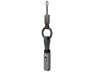 Keychain with a strap and a small device on a white background