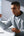 Two people sitting at a desk with a laptop, one holding a straw and wearing Baseus Eli Sport 1 Open-Ear TWS Earbuds A00064400121-00 Black