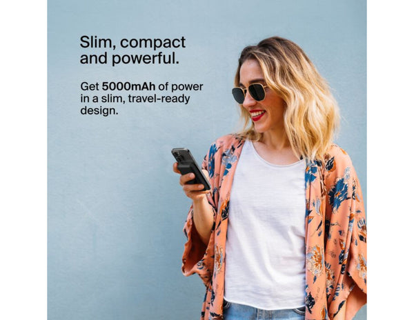 Woman holding a phone with Belkin BoostCharge Magnetic Wireless Power Bank 5000mAh with Fold-out Stand – BPD004btBK – Black and  promotional text about power and design on a light blue background