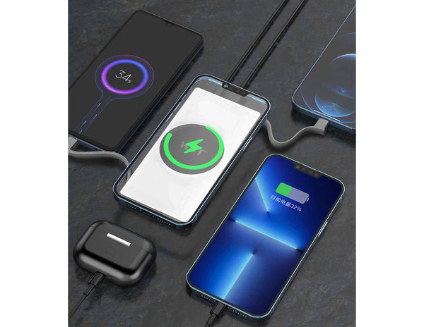 Multiple smartphones with charging icons on a dark surface