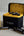 TakTik battery pack with batteries and charger on a gray surface
