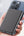 Person holding a smartphone with a Acefast M8 5000mAh Power Bank against a light background