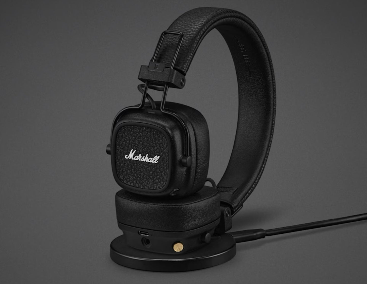 Black Marshall headphones on a gray background