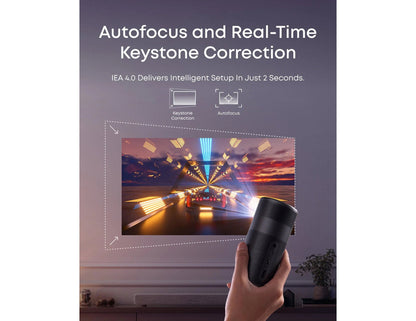 Hand holding a Anker Nebula Capsule Air (D4112211) HD Portable Projector with a screen displaying a projection of a scenic view, emphasizing autofocus and real-time keystone correction features.