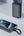 Phone with a power bank and wireless charger on a light gray background